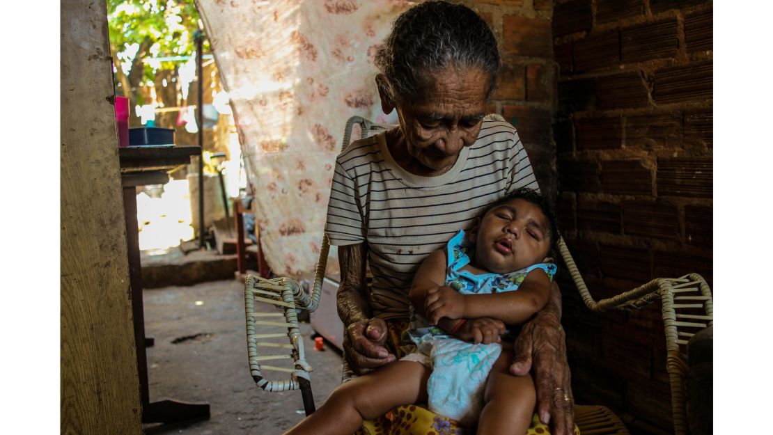 Grandmothers are often called upon to help with child care. Maria de Rosilene is the primary caregiver for her grandson, Eduardo, who cannot walk. "It's hard for Maria because he is getting heavy," said Diniz.