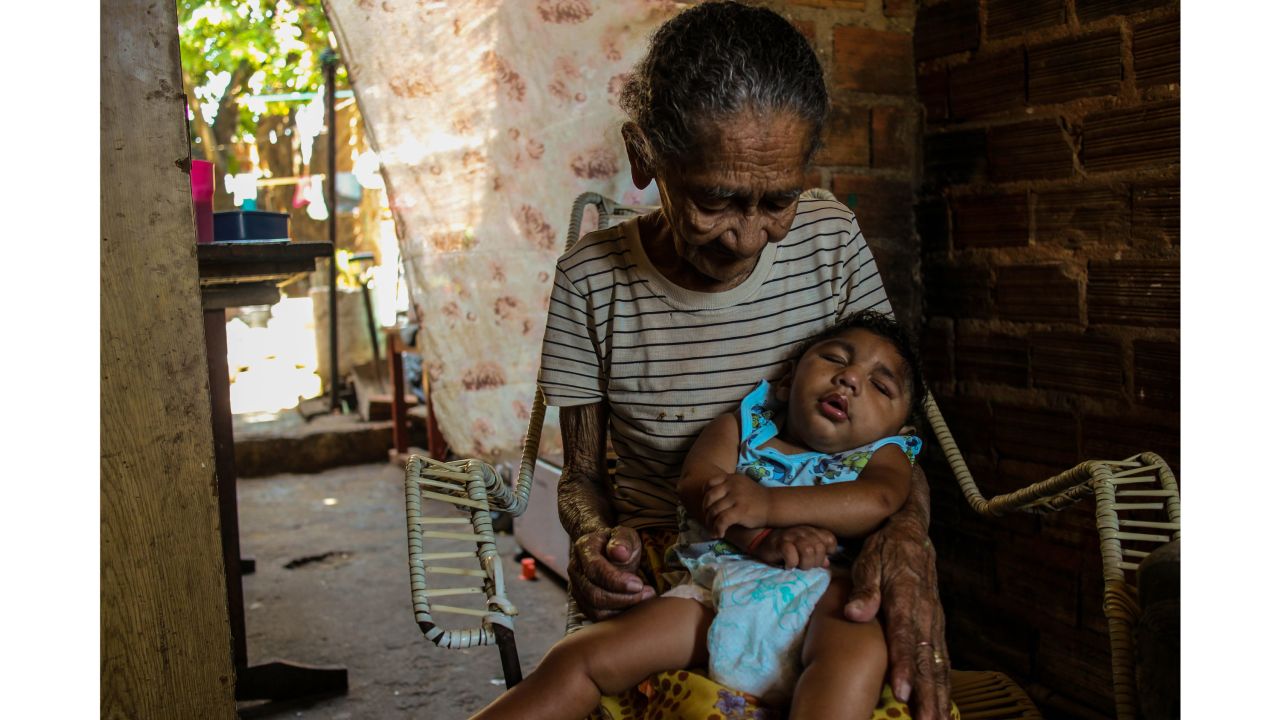 Grandmothers are often called upon to help with child care. Maria de Rosilene is the primary caregiver for her grandson, Eduardo, who cannot walk. "It's hard for Maria because he is getting heavy," said Diniz.  