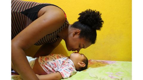 Rosana Sampaio da Silva and her son, Samuel Emanuel, who has microcephaly. Rosana quit her job as a teacher, but her husband's salary cannot pay for medications or visits to early stimulation treatments in Maceió, an hour away.