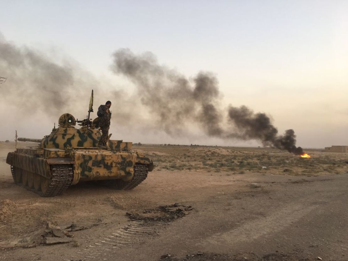 An SDF tank creates a smokescreen to conceal its position on the frontline. 