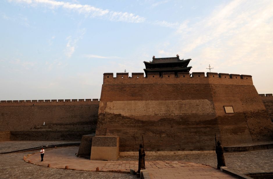 The Pingyao ancient city wall was built to defend the city and is surrounded by a moat designed to provide further protection for the city's inhabitants. 