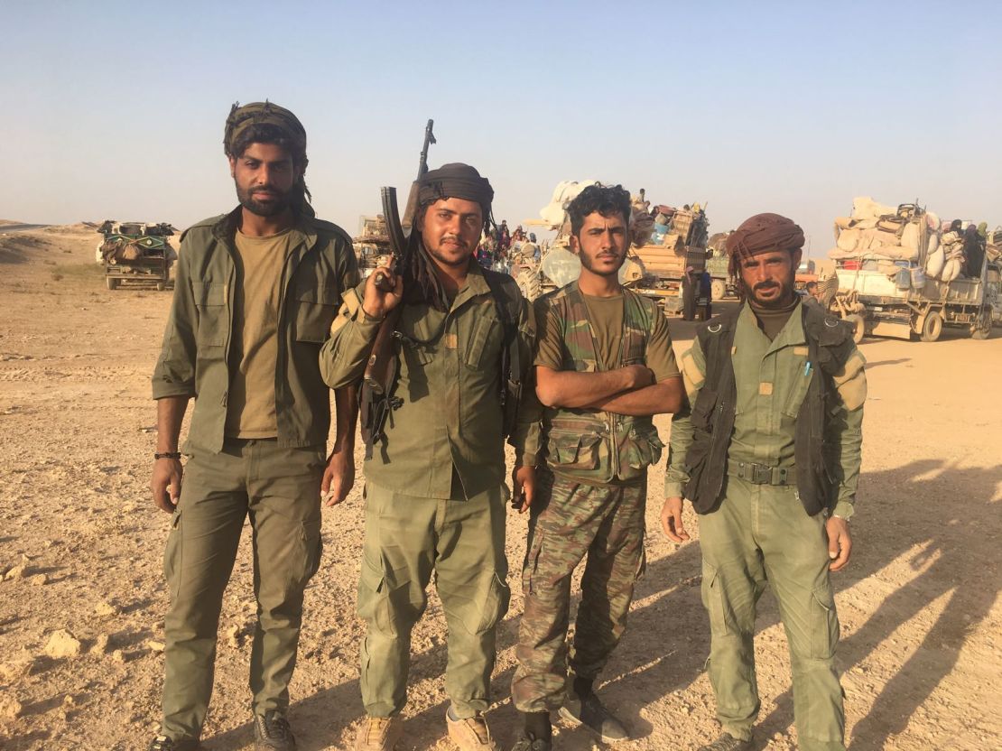 SDF fighters at a checkpoint outside Deir Ezzor. Their job is to search each family fleeing the city. 