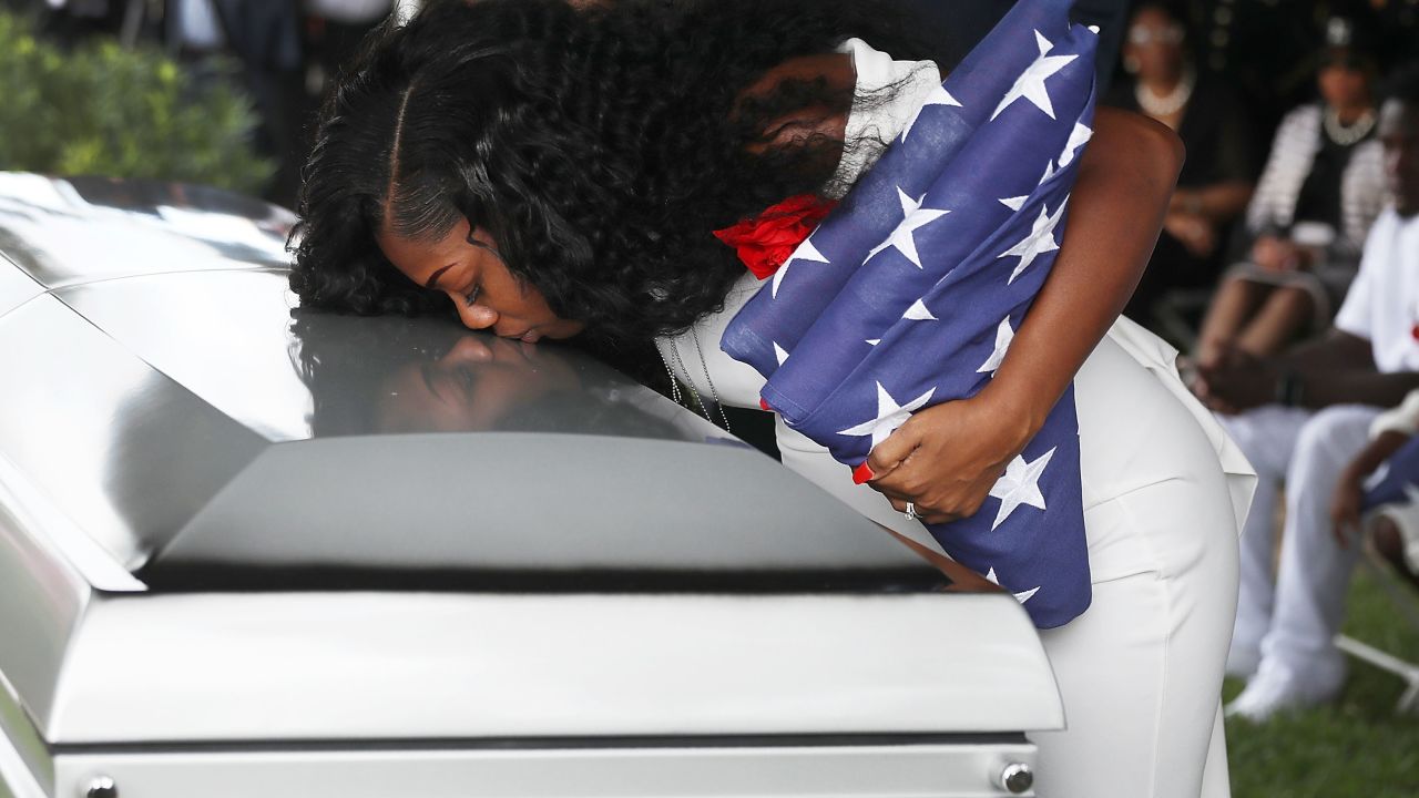 HOLLYWOOD, FL - OCTOBER 21:  Myeshia Johnson kisses the casket of her husband U.S. Army Sgt. La David Johnson during his burial service at the Memorial Gardens East cemetery on October 21, 2017 in Hollywood, Florida. Sgt. Johnson and three other American soldiers were killed in an ambush in Niger on Oct. 4.  (Photo by Joe Raedle/Getty Images)