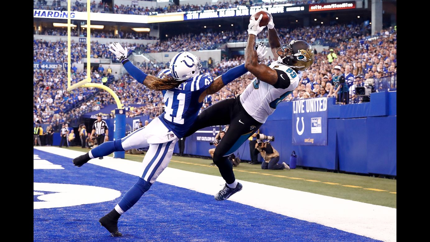 Jacksonville tight end Marcedes Lewis catches a touchdown pass over Indianapolis' Matthias Farley during an NFL game on Sunday, October 22. Jacksonville shut out the Colts 27-0.