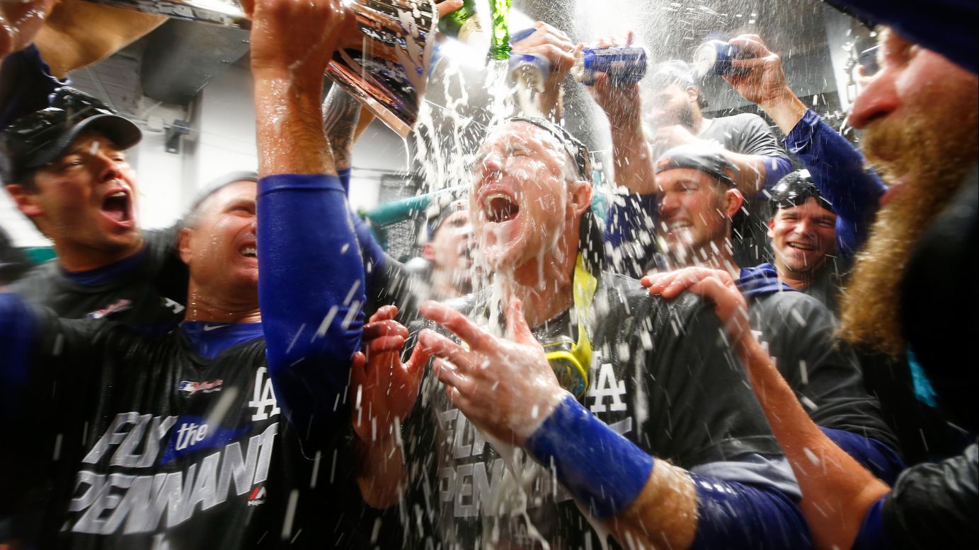Chase Utley is doused in the clubhouse as the Los Angeles Dodgers celebrate their National League title on Thursday, October 19. The Dodgers defeated the Chicago Cubs in five games to advance to their first World Series since 1988.