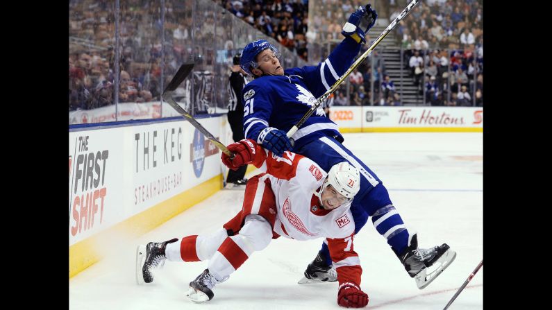 Detroit's Dylan Larkin, bottom, collides with Toronto's Jake Gardiner during an NHL game in Toronto on Wednesday, October 18.