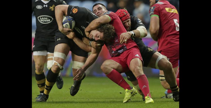Wasps rugby player Will Rowlands is tackled by Harlequin's Dave Ward during a Champions Cup match in Coventry, England, on Sunday, October 22.