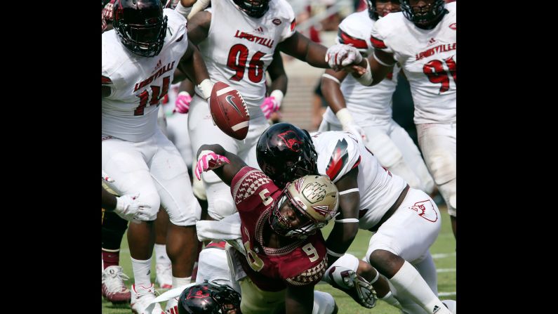 Florida State running back Jacques Patrick, bottom, fumbles the ball into the end zone during a college football game against Louisville on Saturday, October 21. One of Patrick's teammates recovered the ball for a touchdown, but the Seminoles still lost 31-28.