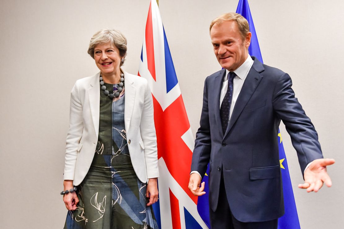 British Prime Minister Theresa May (L) is welcomed by European Council President Donald Tusk for a bilateral meeting during an EU summit in Brussels.