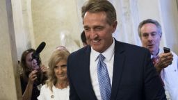 Sen. Jeff Flake (R-AZ) and his wife Cheryl Flake leave the U.S. Capitol as they are trailed by reporters, October 24, 2017 in Washington, DC.