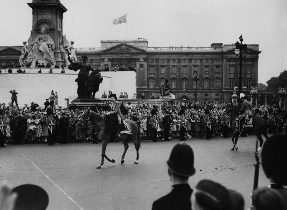 Queen Elizabeth II rides the horse "Winston" past crowds on June 11, 1953.