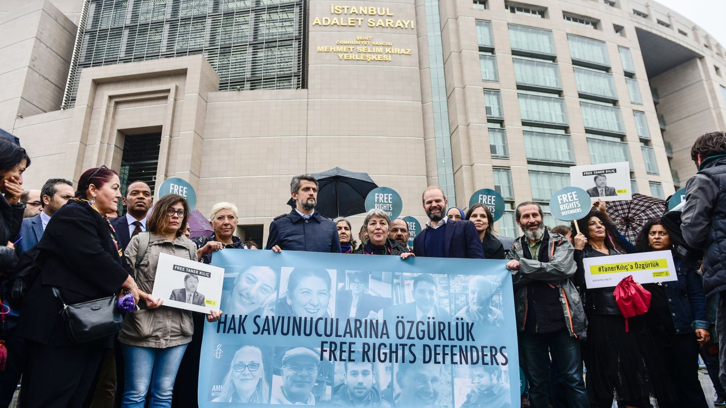 Protesters rally in October outside an Istanbul courthouse where 11 human rights activists face trial.