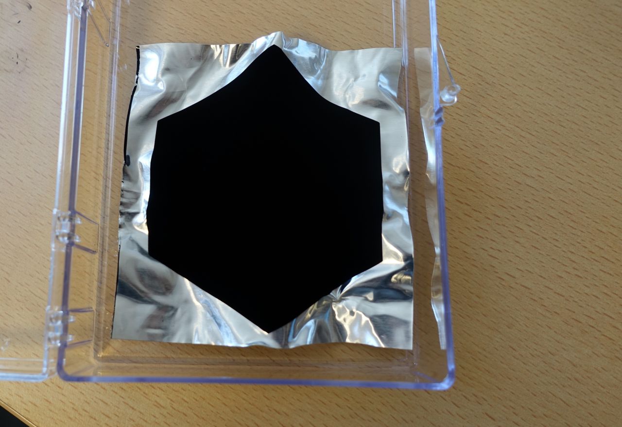 ... but once covered with Vantablack, all wrinkles and roughness seem to disappear, because the material absorbs 99.96% of all light.