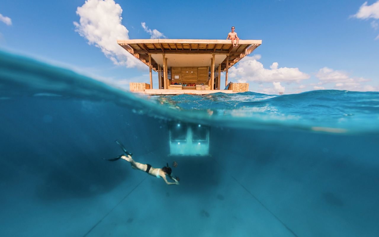 At the Manta Underwater Room, part of the Manta Resort, guests sleep in an underwater bedroom, where they can observe the passing sea creatures.
