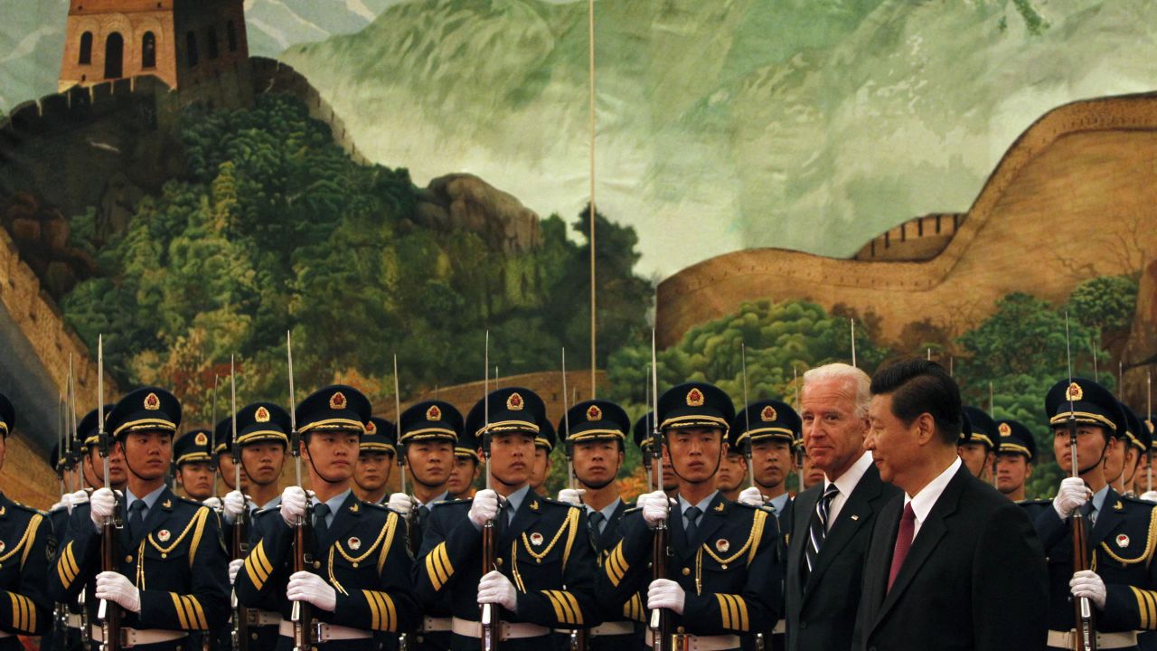 Xi and US Vice President Joe Biden inspect an honor-guard contingent during a welcoming ceremony in Beijing in 2011.