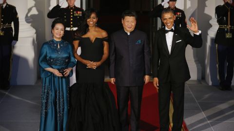 Xi and Peng pose with the Obamas before a state dinner in Washington in 2015.