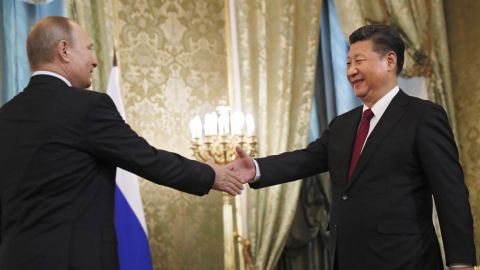 Xi shakes hands with Russian President Vladimir Putin before a meeting in Moscow in July 2017.