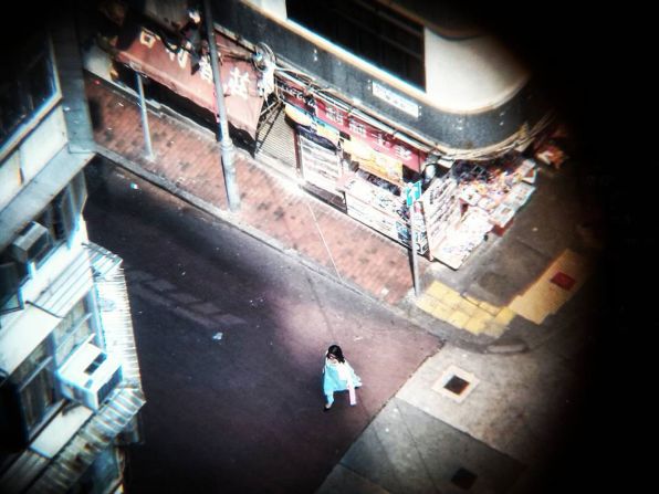 A pedestrian is seen at the intersection of Parkes Street and Bowring Street in Hong Kong.