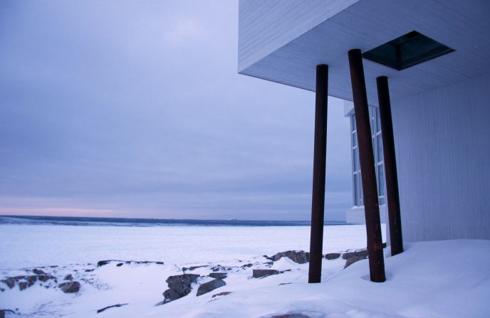 In winter, the jagged white building blends into the landscape.