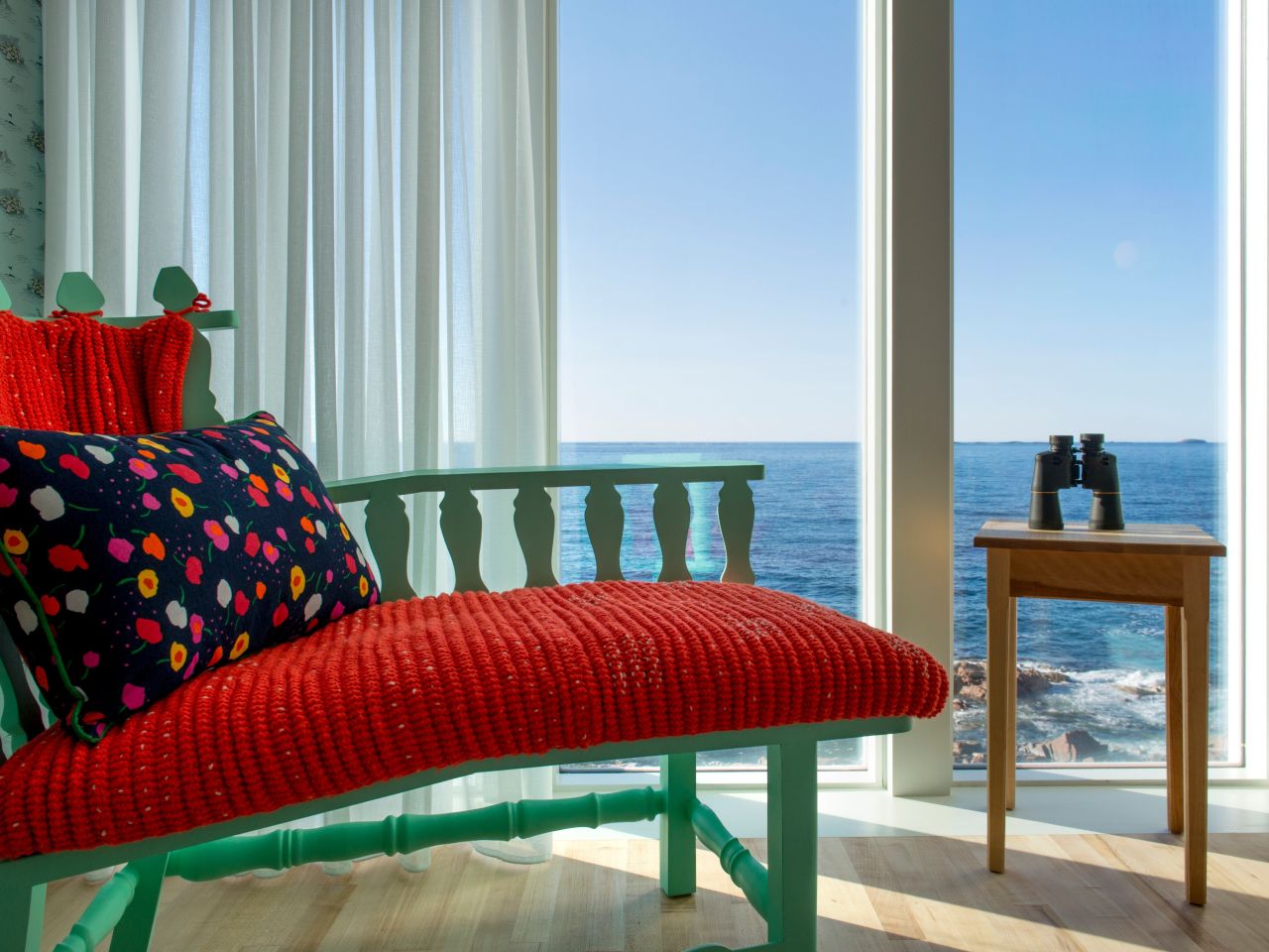 Each of the inn's 29 suites features floor-to-ceiling views of the dramatic seascape beyond.