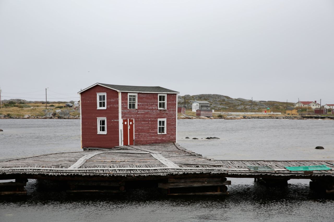 Weathered buildings dot the windswept landscapes of Fogo Island.