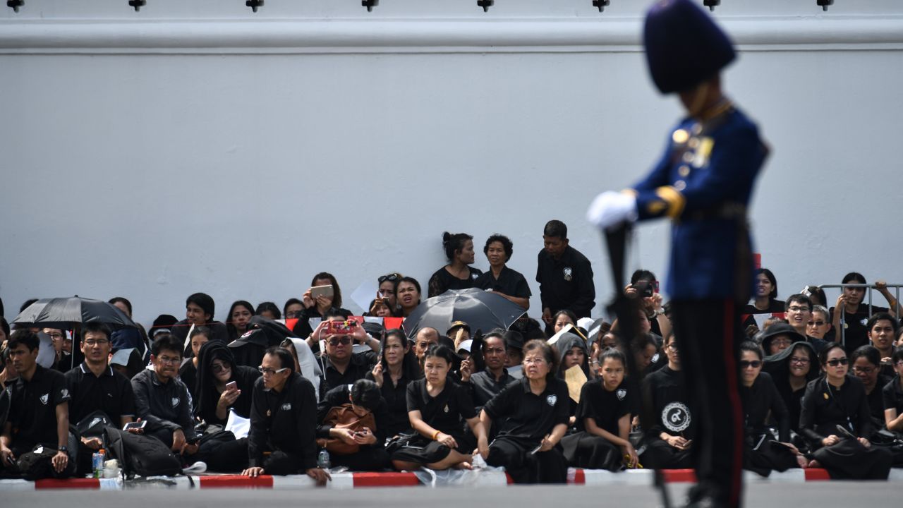 Mourners attend the funeral procession.