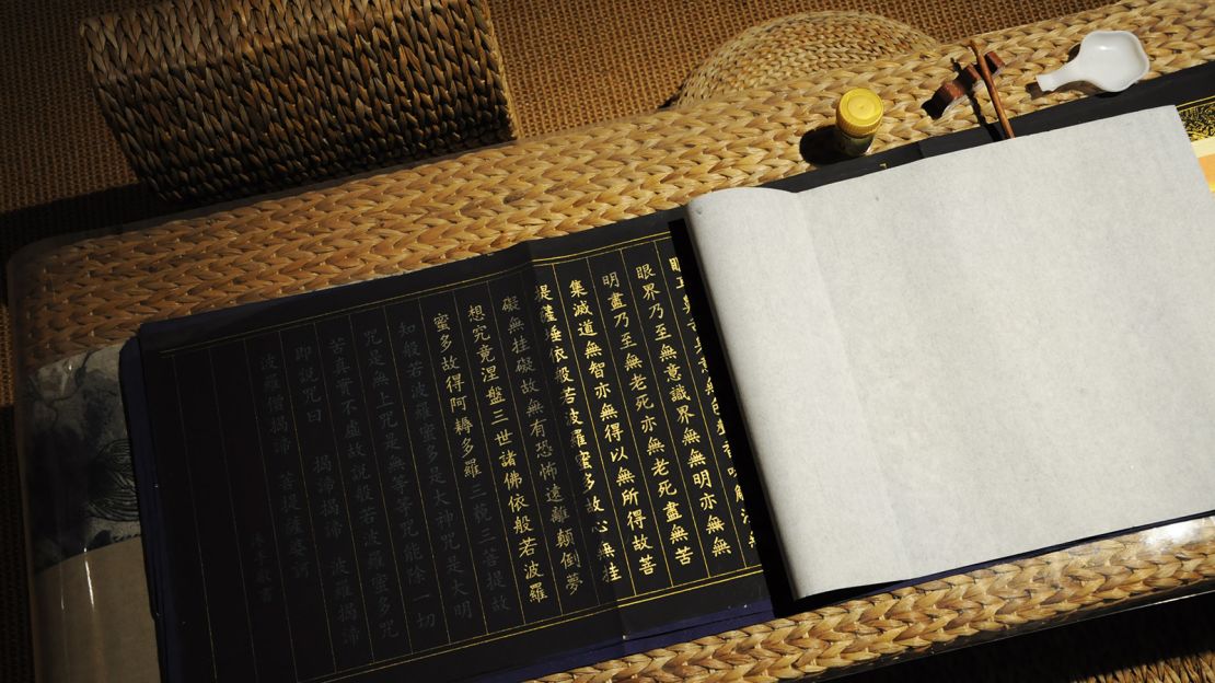 Mu Xin Court guests can practice writing Buddhist mantras.