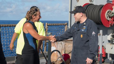 USS Ashland Command Master Chief Gary Wise welcomes aboard Jennifer Appel.
