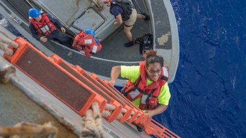 Tasha Fuiava climbs to board the Ashland.