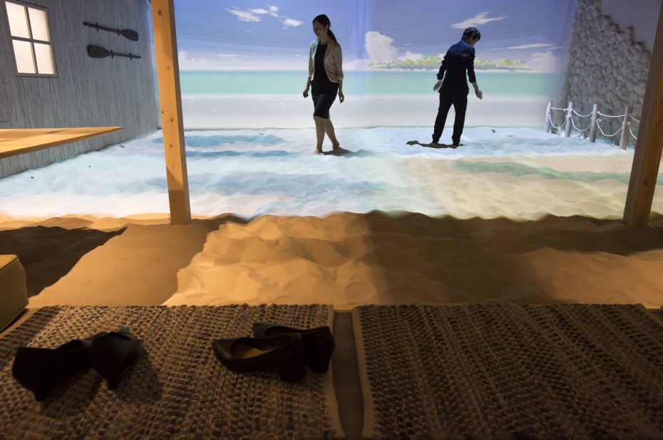 A beach breakout area is another example of how projection mapping has been used to create a non-arcade feel to the gaming center.