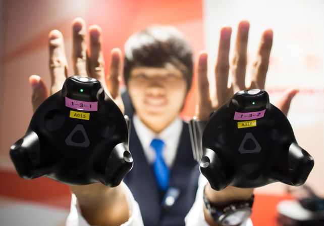 The use of haptic gloves means that players can use their hands to interact with the virtual world -- grabbing floating hammers, bananas and turtles, and then lobbing them at enemies.