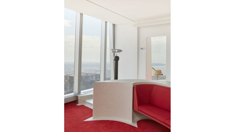 <strong>Red hot:</strong> The striking carpets and sofas are outfitted in Saarinen's signature Chili Pepper Red color, capturing the spirit of the original terminal. 