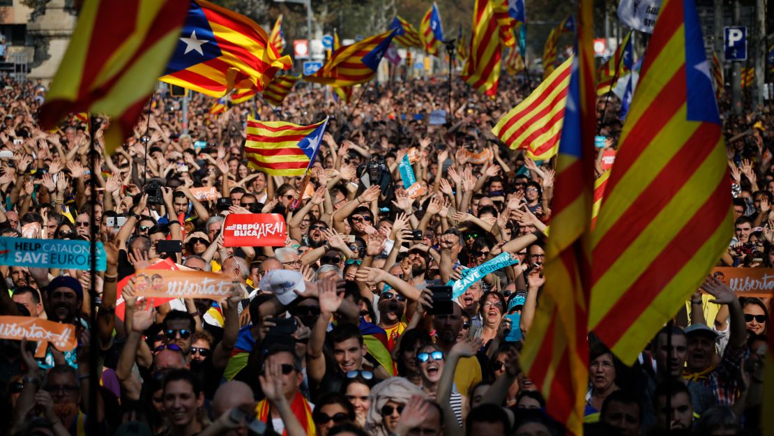 Protesters with Catalan separatist flags celebrate in Barcelona on Friday.