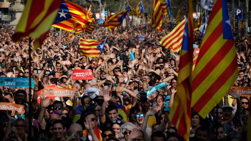 Protesters with Catalan flags take part in a rally in Barcelona, Spain, Friday, Oct. 27, 2017. Catalonia's parliament on Friday will resume debating its response to the Spanish government's plans to strip away its regional powers to halt it pushing toward independence.