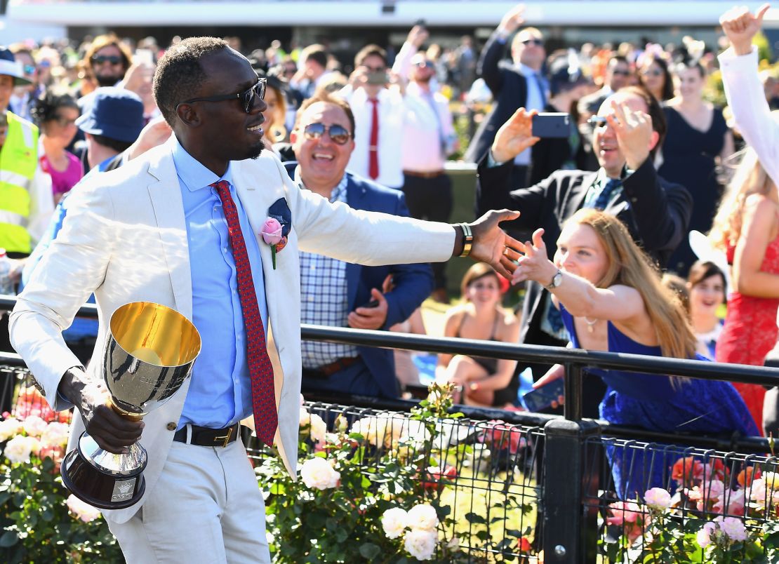 Usain Bolt presented trophy on Oaks Day at Flemington in 2016 