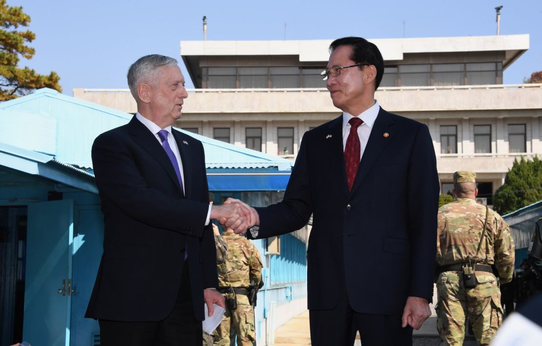 US Secretary of Defence Jim Mattis (L) shakes hands with South Korean Defence Minister Song Young-Moo (R) as they visit the truce village of Panmunjom in the Demilitarized Zone (DMZ) on the border between North and South Korea on October 27, 2017. 
