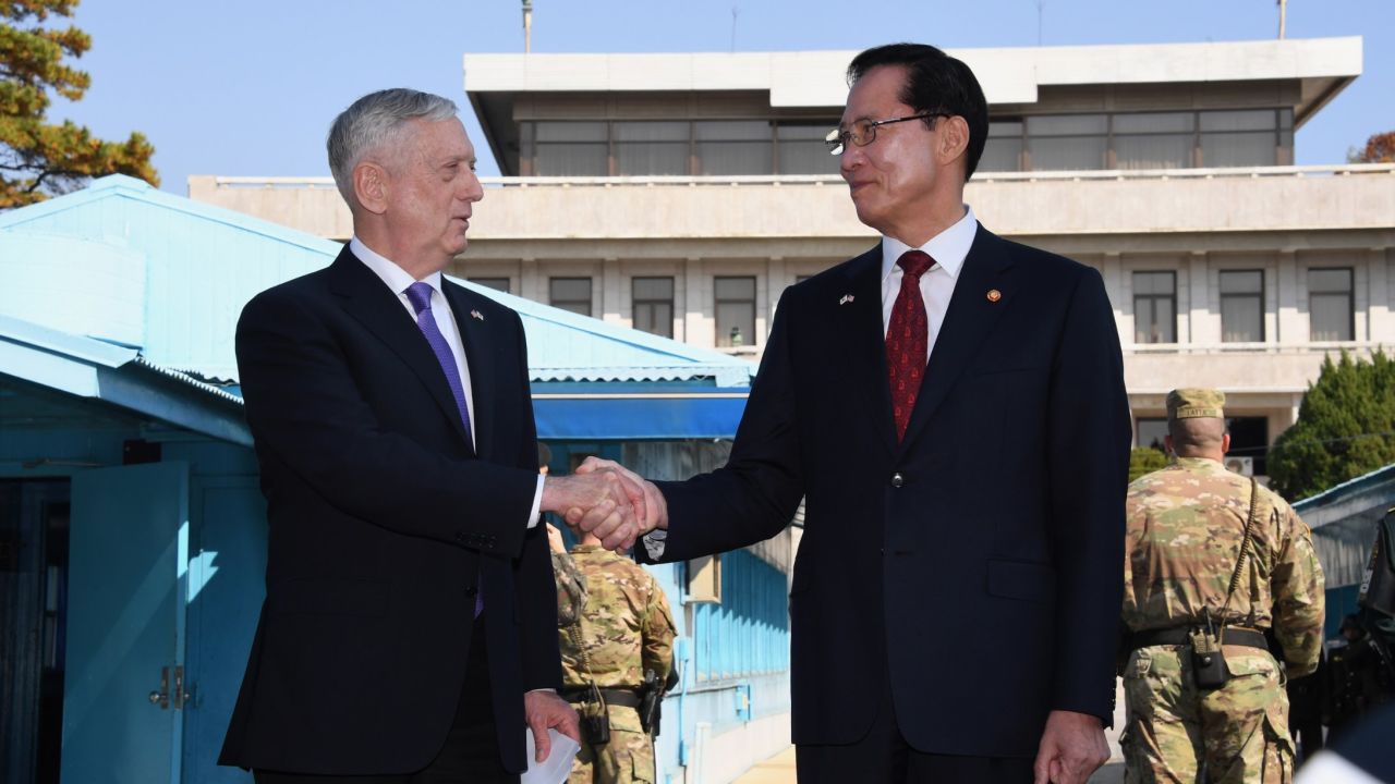 US Secretary of Defence Jim Mattis (L) shakes hands with South Korean Defence Minister Song Young-Moo (R) as they visit the truce village of Panmunjom in the Demilitarized Zone (DMZ) on the border between North and South Korea on October 27, 2017. 

