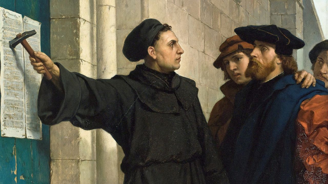 Martin Luther posting his 95 theses on the church door in Wittenberg, Germany.