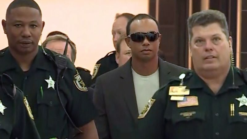 See multiple cops escort Tiger Woods to court CNN