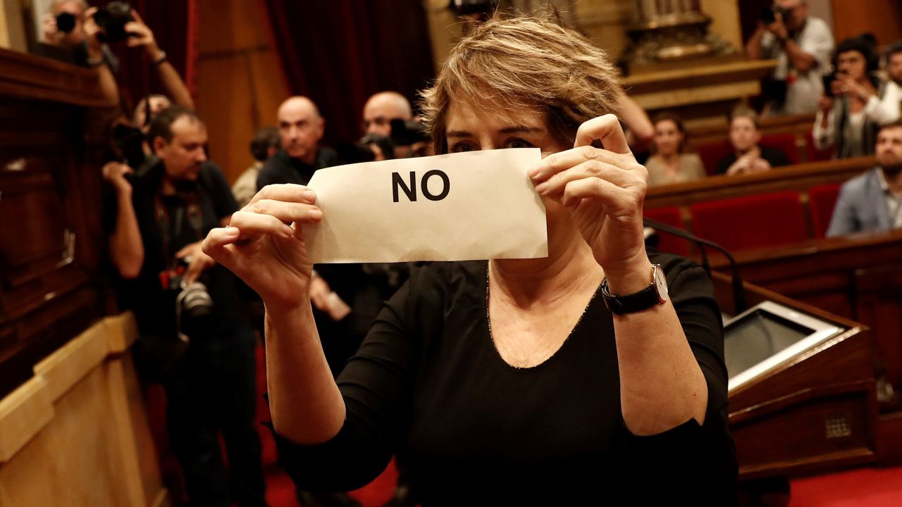A deputy of Catalonian Parliament, who is oppose to independence of Catalonia holds a "No" ballot during the independence voting at Catalonian Parliament in Barcelona, Spain.