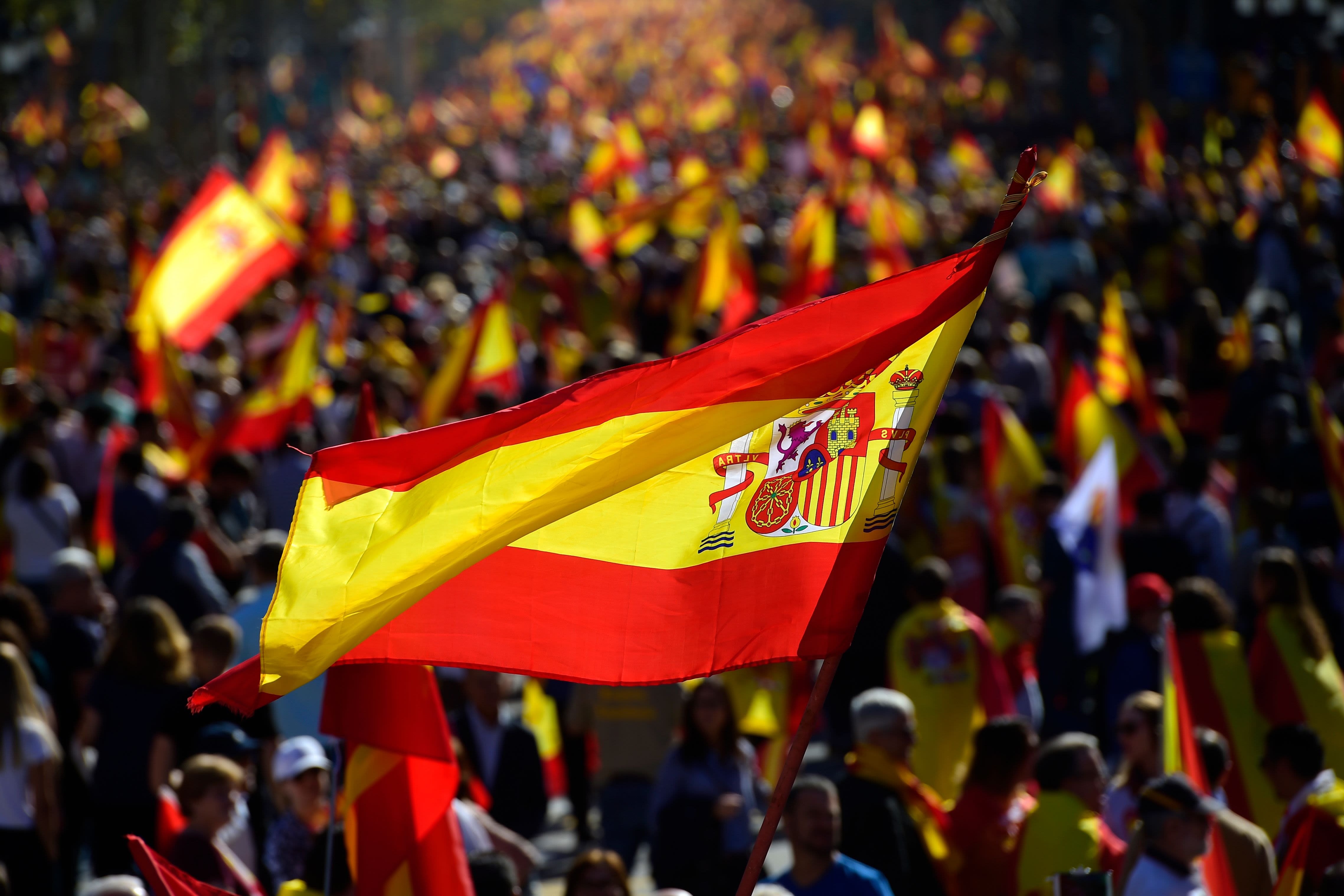 Anti-independence Catalan protestors carry Spanish and catalan flag during  a demonstration for the unity of Spain on the occasion of the Spanish Natio  Stock Photo - Alamy