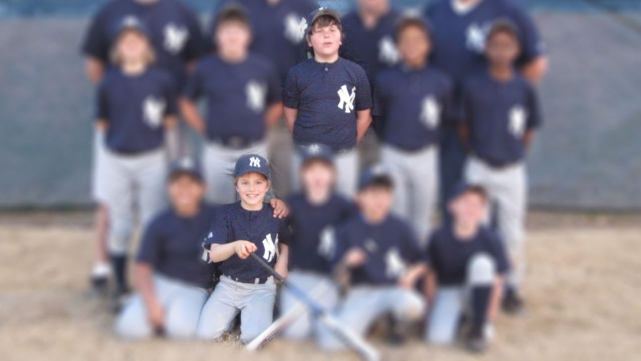 Dustin (bottom row, second from left) and Joseph (top row, center) played Little League together.