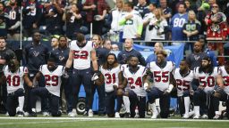 SEATTLE, WA - OCTOBER 29:  Members of the Houston Texans stand and kneel before the game against the Seattle Seahawks at CenturyLink Field on October 29, 2017 in Seattle, Washington. During a meeting of NFL owners earlier in October, Houston Texans owner Bob McNair said "we can't have the inmates running the prison", referring to player demonstrations during the national anthem. (Photo by Otto Greule Jr/Getty Images)