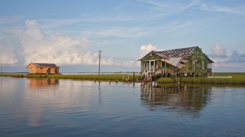 Located 80 miles from New Orleans, this isle has been <a href="index.php?page=&url=http%3A%2F%2Fedition.cnn.com%2F2017%2F03%2F02%2Fus%2Fheart-of-the-matter-climate-change-louisiana%2Findex.html">sinking slowly.</a> Since 1955, it has lost 98% of its land mass to rising sea levels, hurricanes, and the construction of oil and gas canals along the marsh. The US Department of Housing and Urban Development awarded $48 million to the state of Louisiana in 2016 to relocate the community to higher ground off the island.