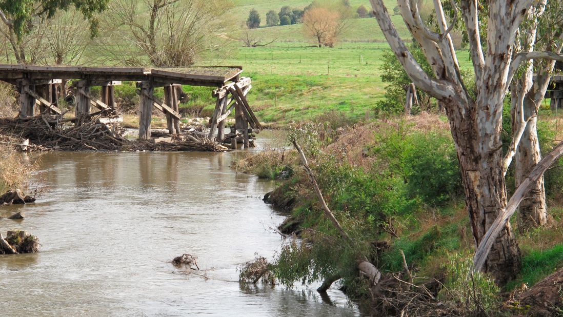 Over 1,000 people had to be moved along with the town's amenities and buildings in Tallangatta in 1956, thanks to the expansion of Lake Hume. The remains of a bridge is pictured.