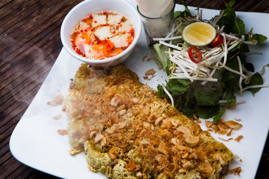 <strong>Don's Bistro:</strong> Traditionally, a banh xeo (savory fried rice paper pancake) would come stuffed with pork, dried shrimp, green onion and beansprouts and rolled up with leaves and vegetables. About three times larger than usual, the banh xeo at Don's overflows with big juicy prawns -- as opposed to the traditional dried shrimp.