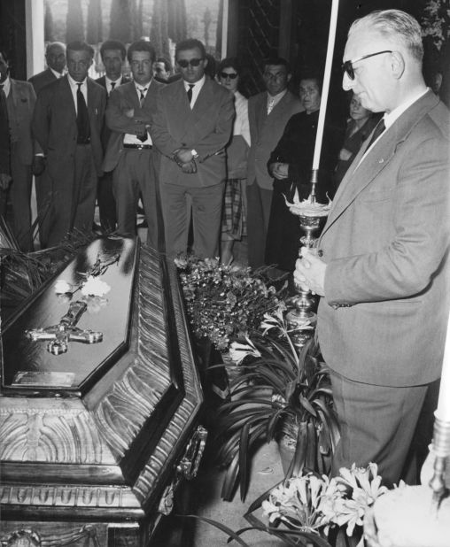 Ferrari attends the funeral of de Portago. Ferrari famously said to his drivers: "Win or die, you will be immortal."
