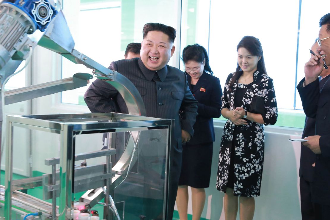 Undated KCNA photo released on October 29, 2017 shows North Korean leader Kim Jong Un inspecting the Pyongyang Cosmetics Factory with his wife Ri Sol Ju (2nd right).