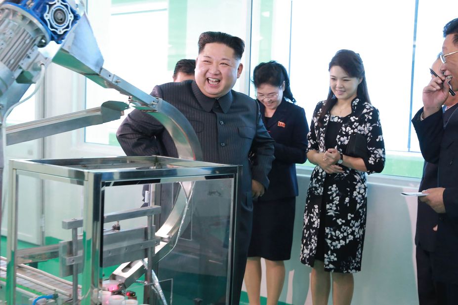 A photo released by North Korean state media in October 2017 shows Kim and Ri touring a cosmetics factory.