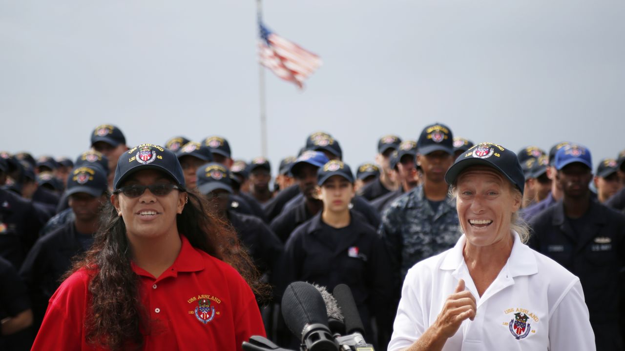 Jennifer Appel, right, and Tasha Fuiava speak on the deck of the USS Ashland  in Okinawa, Japan.